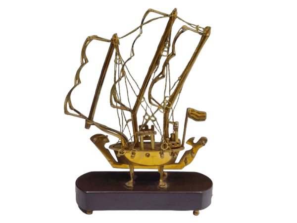 Intricately detailed brass novelty ship showpiece, showcasing elegant maritime craftsmanship. Perfect for home decor or as a unique gift, adding a touch of nautical charm to any space.