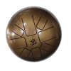 Brass tongue drum with a sleek design and resonant tone, ideal for meditation, relaxation, and musical exploration. Features precision-cut tongues for a rich sound.