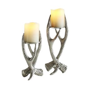 Intricately carved aluminum candle stand with ornate detailing, showcasing a blend of elegant design and craftsmanship.