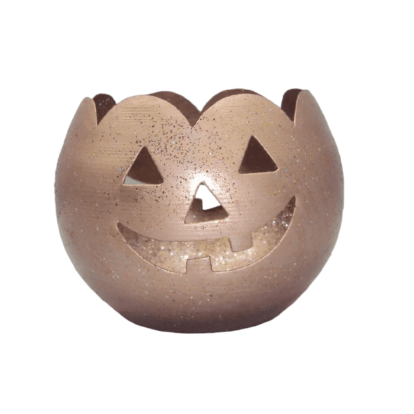 Spooky Halloween tealight holder featuring a carved pumpkin design with a glowing face, perfect for adding a festive touch to your Halloween decorations. The holder casts a warm, eerie light when a tealight candle is lit inside.