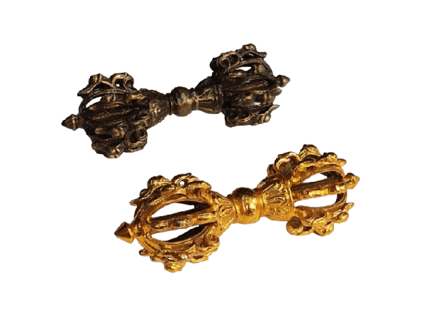 Brass dorje vajra with intricate designs, symbolizing spiritual strength and enlightenment. Ideal for meditation, rituals, and as a decorative piece in spiritual practices.